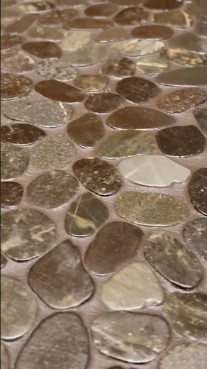 Sealing pebbles with Aquamix Enrich n' Seal. 🚿😏💥💪#Shower #Stone #Pebble #Clean #Natural #NewHome