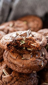 Andes mint cookies are the perfect chocolate-mint treat - soft, rich, and loaded with melt-in-your-mouth minty goodness. Full recipe directions on dashofsanity - Happy Holidays! #cookie #mint #chocolatemint #recipe #christmascookies 1 cup butter softened 3/4 cup brown sugar 3/4 cup sugar 2 eggs at room temperature 2 cups flour 3/4 cup cocoa powder 1/2 teaspoon baking soda 1 teaspoon baking powder 1/2 teaspoon salt 2 teaspoons vanilla extract 1/2 cup chocolate chips 1 1/2 cups chopped Andes Mints