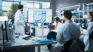 PhD Professor Teaching a Group of Science Students the Basics of Biological Engineering. Head of Laboratory Showing Presentation on a TV Screen Before Practical Education and Technology Demonstration
