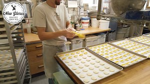 Discover the love and tradition behind every handmade treat at New Glarus Bakery. With over 110 years of history, our bakers pour their hearts into every creation, using only the finest ingredients. Taste the difference of genuine craftsmanship in every bite, from our iconic pastries to our savory breads. Experience homemade care and attention in every indulgence. Watch the video below to explore our rich heritage. Order for in-bakery pickup: https://order.toasttab.com/online/newglarusbakery Ord