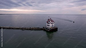 Lorain harbor light house in the middle of lake Erie in Ohio state, during twilight.