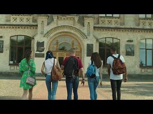 students walk through the foyer of a modern university | Free Stock Footage - No Copyright