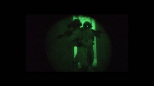 CIRCA 2010s - Night vision footage of Navy Seal personnel conducting a terrorist raid similar to the one which killed Osama Bin laden.