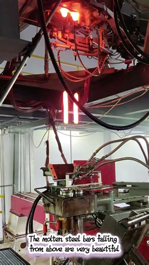 The molten steel bars falling from above