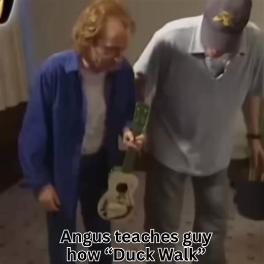 Angus shows German TV Host how to do his famous Duck Walk. 🤣 | AC/DC Rock Brigade