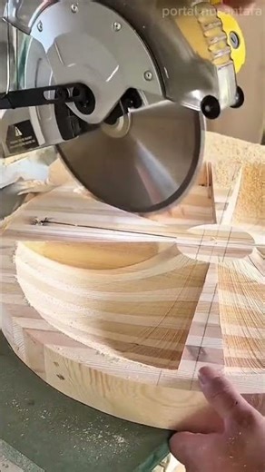cutting wooden boards using a miter saw to create precise angular segments for a circular furniture