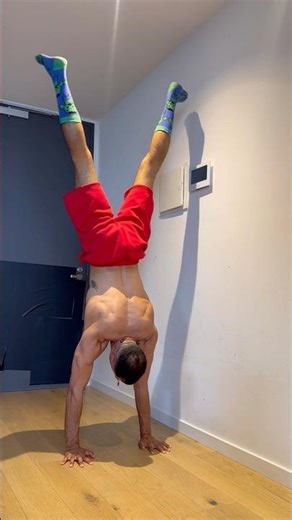 Handstand straddle to full - wall assisted