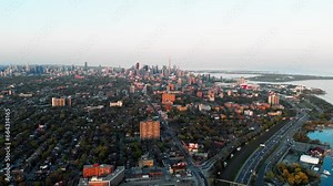 Panoramic aerial view of metropolis in Canada in autumn. Dynamic video, breathtaking noisy metropolis and green tree crowns decorate city. Don't let metropolis make you unhappy, enjoy nature around