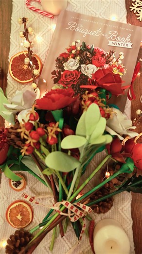 The Bouquet in a Book: Winter is the second installment in the award-winning series of papercraft books! 😍 Turn pages into petals and make this stunning bouquet by just adding glue! Order today direct from our shop site and make your very own winter-themed bouquet! #papercraft #bouquetinabook #paperbouquet #paperflowers #papercrafting #crafting #dandcbooks #bouquetbooks #crafty | David and Charles