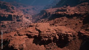 Behold the breathtaking splendor as you peer into the depths of the red stone canyon from a captivating high point of view.