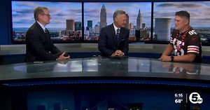 Browns fan throws beer can 50 yards to worker on passing ship. Becomes local legend.