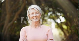 Mature woman, portrait and happy in outdoor or forest for break, rest and retirement with joy in Germany. Female person, smile and confident with arms crossed in woods or park and satisfied in nature