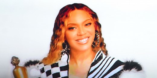 Beyoncé Wears Dramatic Black and White Form Fitting Dress to Accept Brit Awards