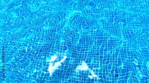 Water texture in a swimming pool with blue tiles