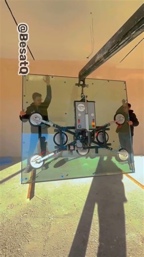 Massive Glass Panel Installed with Precision Machinery