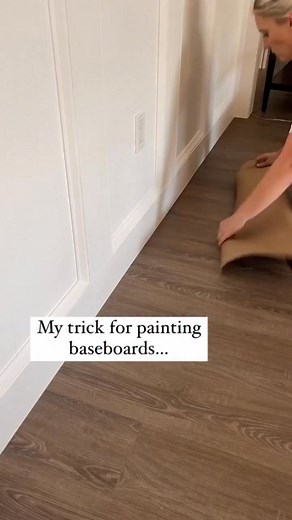 Easily paint your baseboards! I use a piece of crate paper (wrapping paper or thin cardboard works too) and I slide it under the baseboard or butt it up tightly to the baseboard. Then I roll the paint on with a 4-6in foam roller and the excess paint gets on the paper! It’s easy and mess-free! . #diy #diytips #homeimprovement #homerenovation | MrsAshleyFrench
