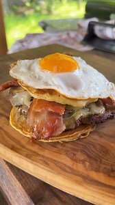 🔥 Smash Burgers with Maple Pancake Buns and Fried Eggs cooked on the Weber Grills Canada Slate 30” Rust-Resistant Griddle #ad🔥 Combining savory and sweet for the ultimate burger experience! Juicy smash burgers topped with cheddar, caramelized onions, and fried eggs, nestled between fluffy maple pancake buns. Drizzle a little extra maple syrup on top for the perfect finishing touch. #WeberGrillsCA | GrillHunters