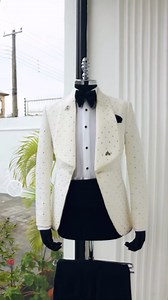 Deji & Kola on Instagram: "A square pattern jacquard, shawl lapel tuxedo suit, Swarovski stones, cummerbund & tux pant Trosuer. Features: Jacket Cummerbund Pant trouser Additional Items On Request: Shirt Signature accessories Tie Price: Available on website. To Order: iMessage, Text or WhatsApp : +234 817 943 5662 Email: info@dejiandkola.com Website: dejiandkola.com #bespoke #tailored #tailoredsuit #naija #naijaweddings #madeinnigeria #madeinafrica #suit #suits #suitstyle #red #tailoredsuit #ivo