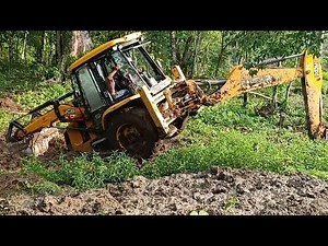Stuck JCB Backhoe Struggles in Deep Sticky Mud