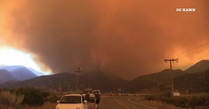 Homes burned as winds push California fire into desert floor