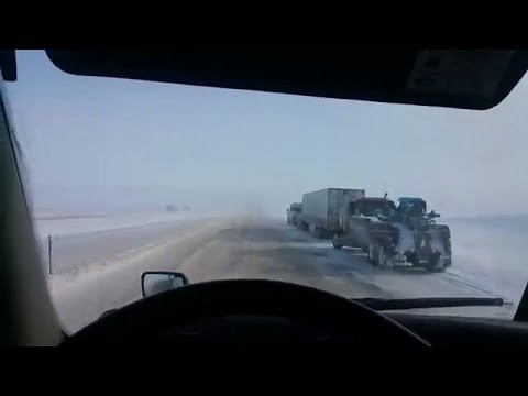 HOW TO drive a Semi Truck on snow and icy freeway safely, using warning bumps and emergency blinkers