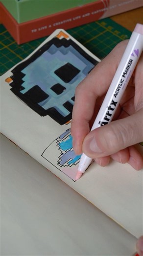 Drawing pixel UFO with acrylic markers
