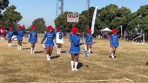St. Theresa High School's drum majorette group is on stage, delivering an impressive performance under the military category, at Manzini Club for Inyatsi Schools Arts & Culture Competitions 2025. | Eswatini Positive News