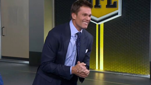 Tom Brady screams at Rob Gronkowski before being tackled by Michael Strahan