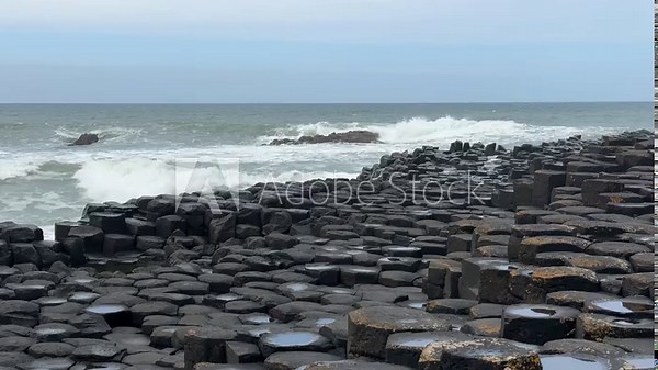 The Giant's Causeway, a UNESCO World Heritage Site on Northern Ireland's Antrim Coast, features 40,000 interlocking basalt columns formed by volcanic activity. Its hexagonal stones and coastal beauty