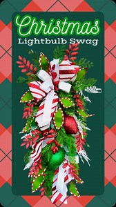 🎄✨ Let’s get crafty this holiday season with this beautiful Christmas Lightbulb Swag! This eye-catching swag is bursting with festive fun—glittery lightbulbs, sparkling red leaf sprays, lush cypress greenery, and whimsical peppermint-striped leaves come together to create a show-stopping piece. Find all the supplies you need to make this stunning holiday swag and more at The Wreath Shop.🎅 🎄 🎄 #homedecor #wreath #crafting #diy #diycrafts #diywreath #wreathmaking #wreathsofinstagram #wreathsup