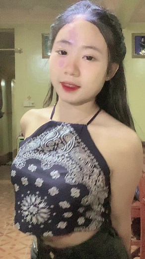 Confident Outfit Showcasing a Blue Halter Top