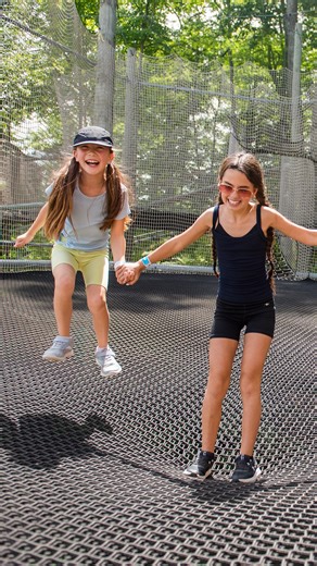 Climb, bounce, and explore high above the forest floor at Canopy Climb Net Adventure! 🌲🧗‍♀️ With rope bridges, climbing features, and netted pathways, it's a year-round adventure the whole family will love. | Blue Mountain
