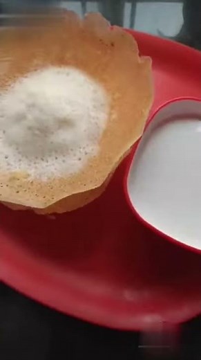 Appam with sweetened coconut milk