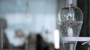 Work of a mixer in a scientific laboratory. A mixer mixes reagents in the laboratory. Ecological laboratory. Scientific laboratory.