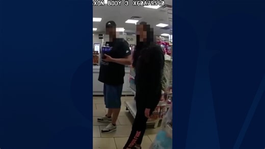 Woman uses hand signal to report suspected abuser