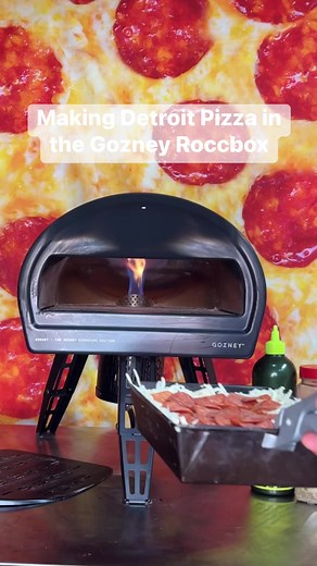 How I make Detroit Style Pizza in the Gozney Roccbox. First, we’re working with an 8x10 pan. I am a parbaker when it comes to detroit crusts. I like to let the crust cool on a bakers rack to allow the moisture to escape and promote a crispy bottom. Then I’ll oil the pan and place the crust back in it.For the cheese, i like a blend of preshredded cheddar and low moisture mozzarella. You want dry or starch added cheese to create that raised frico edge. I prefer the taste of caramelized cheddar ove
