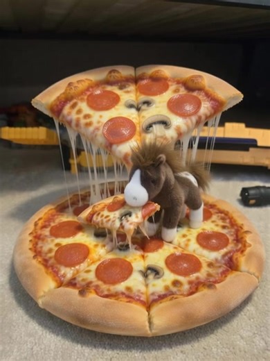 horse boy eating a pizza big as a dinosaur