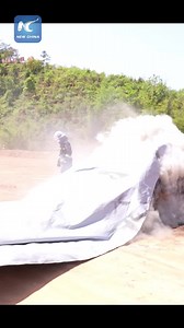 A company in Shangyou County in China's Jiangxi has developed a high-temp fire blanket designed to quickly smother car fires. It cuts off oxygen, limits toxic smoke, and helps stop the fire from spreading. #FireSafety #Innovation #ChinaTech | China Xinhua News