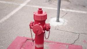 Red fire hydrant on the street parking