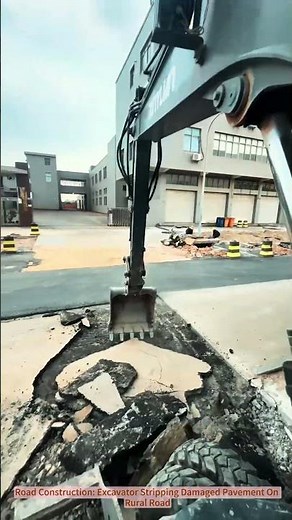 Road Construction: Excavator Stripping Damaged Pavement On Rural Road