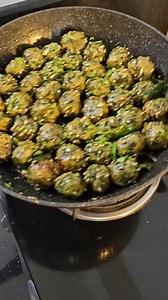 Methi Palak Goli muthiya (Ingredients in the description box) 1.5 cup methi leaves, chopped 1.5 cup palak leaves, chopped 1 cup coriander leaves, chopped 1/2 cup green garlic, chopped 1/2 Cup Bajra atta or besan 1 cup whole wheat flour 1 tsp haldi 1 tsp ajwain 1 tsp sesame seeds 1 tsp jeera 3 tbsp oil Salt to taste 2 tbsp sugar 1/4 tsp hing 3-4 t tbsp water 2 tbsp ginger chilli paste Tadka 2 tbsp oil 1/2 tsp Mustard, 1/2 tsp cumin, 1 tsp sesame seeds 8-10 Curry leaves 2 green chillies, chopped G