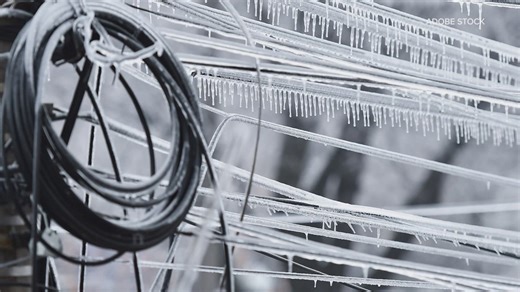 Half an inch of ice paralyzes regions, stalling travel and snaring power lines