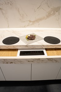 Invisacook is an innovative cooking system that uses invisible induction technology to heat pots and pans directly through the kitchen countertop. While the cookware gets hot, the surface itself remains cool, safe to touch, and completely free of visible burners — creating a modern, minimalist aesthetic without sacrificing performance.The entire cooking process is managed through a dedicated Invisacook controller. This intuitive control unit allows you to adjust temperature levels, activate or d