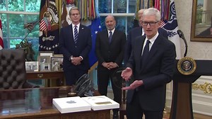 Apple CEO Tim Cook gifts Trump a plaque with a 24-karat gold base