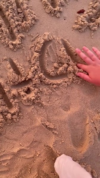 Writing Names in the Sand at the Beach