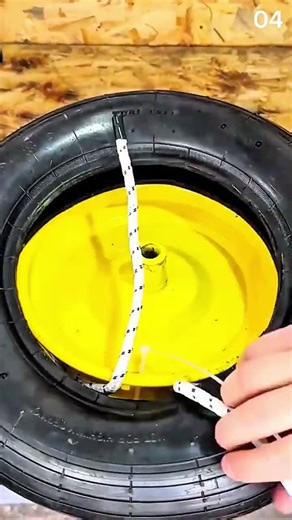 Rope threads through tire—hands tighten knot on wood bench, DIY takes shape