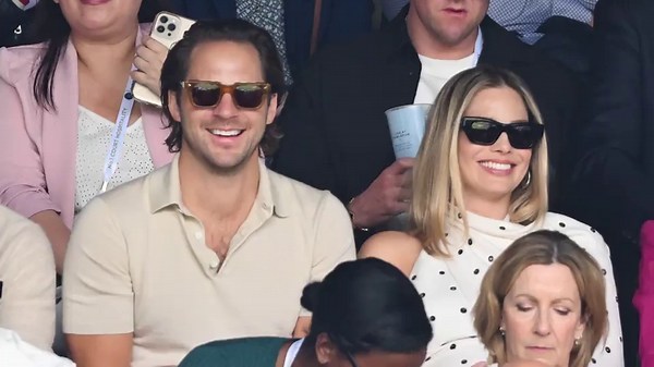 Pregnant Margot Robbie dresses her baby bump in polka dots for Wimbledon date with husband Tom Ackerley