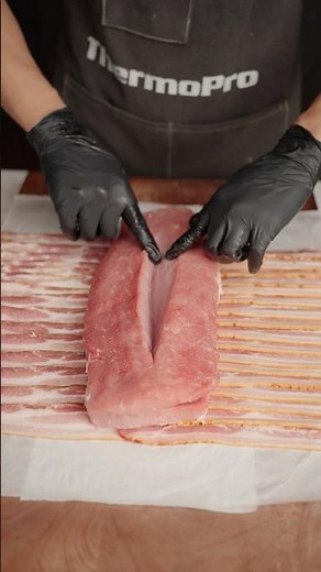 Wrapped pork tenderloin in layers of savory ham and roasted to juicy perfection.