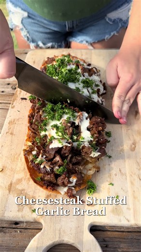We made Cheesesteak Stuffed Garlic Bread for lunch today and it was so good! I used: • garlic bread (mine was premade but you can make your own if you prefer) • 2 lbs shaved beef • 2 sweet onions, thinly sliced • 16 oz mozzarella, shredded Topped it with a mixture of: • parsley • garlic • red pepper flakes • apple cider vinegar • olive oil • salt and pepper I didn’t measure any of it, just put it all in a bowl and mix together. Sauté your onions and cook the beef. Press down the center of the ga