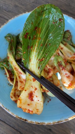 This bok choy “kimchi” salad is a simple side dish that is very easy to make and so delicious. It’s technically not kimchi since there is no fermentation but it has similar flavors. Ingredients: 4 large bok choy Paste: 1.5 tbsp Korean pepper powder or flakes 2 tbsp mirin 1 tsp fish sauce 1 tsp sesame oil 2 cloves grated or minced garlic 1 tsp sugar 1 tsp sesame seeds Cut the ends off the bok choy. Wash thoroughly and pull the leaves apart. Mix the paste ingredients together in a bowl then pour t